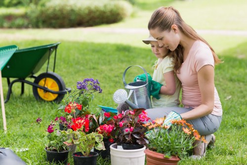 Professional gardener choosing plants in Brentford